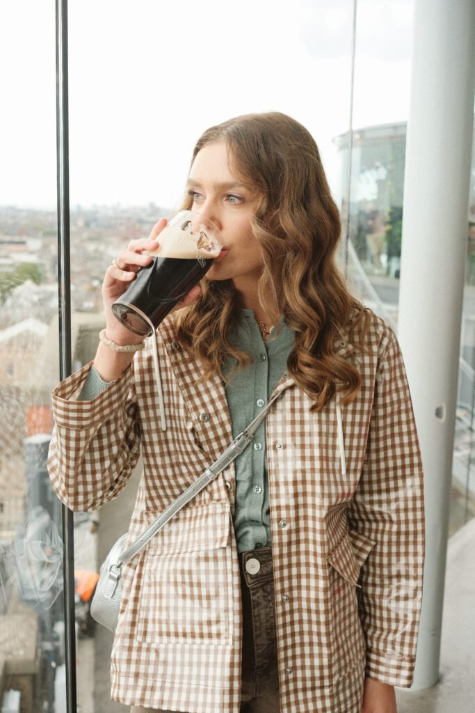 Visiting and exploring the Guinness Storehouse in Dublin, Ireland, learning about the iconic stout's history.