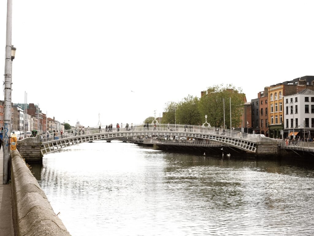 Ha'penny Bridge over the River Liffey in Dublin City Centre, a must-see landmark when visiting Dublin for the first time, with scenic views of the city.