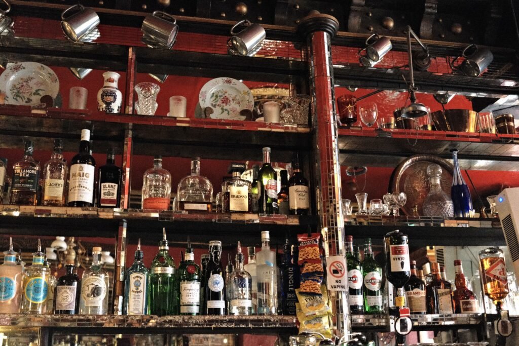 A beautifully stocked bar in one of Dublin’s famous and historic pubs, showcasing a variety of spirits and vintage decor, adding to the authentic Irish pub atmosphere.