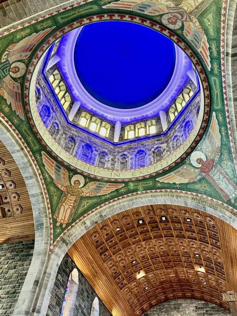 Stunning view of the ornate dome ceiling inside Galway Cathedral, one of the key landmarks in Galway City Center, showcasing its beautiful architecture. This central location is close to several top areas to stay, including popular hotels and accommodations.