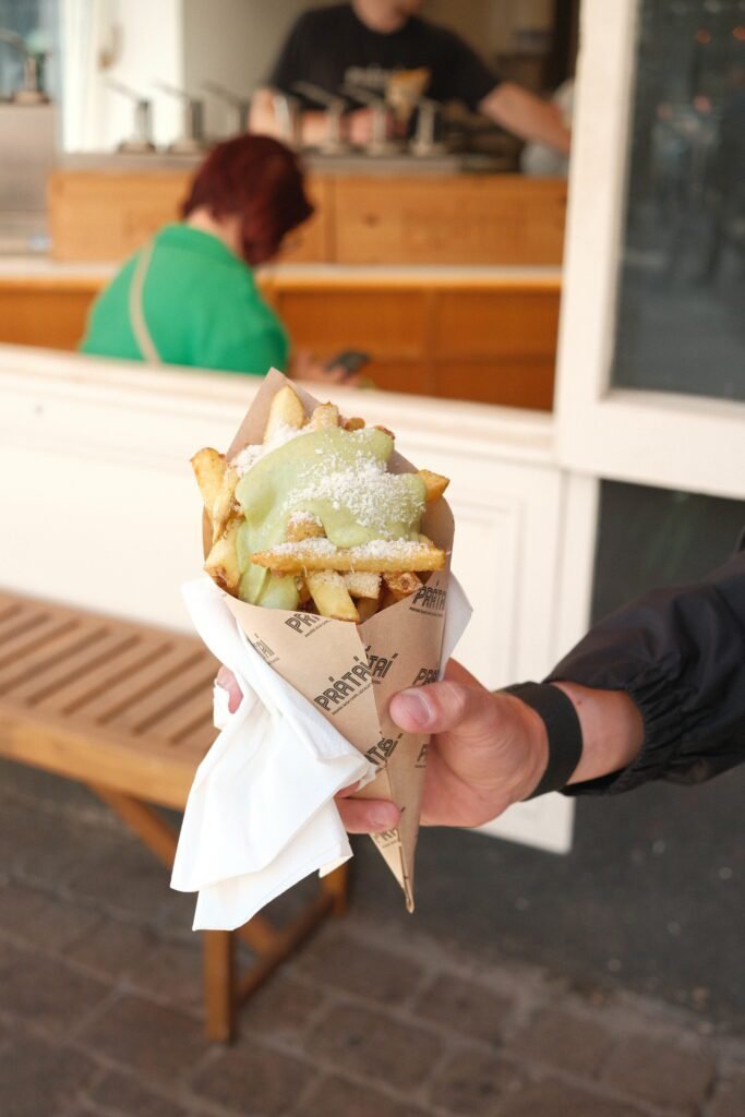 Freshly served fries from Prátaí in Galway, Ireland, known for its gourmet fries and unique toppings. A popular spot for quick bites and casual eats, making it one of the best places to eat in Galway for a snack on the go.