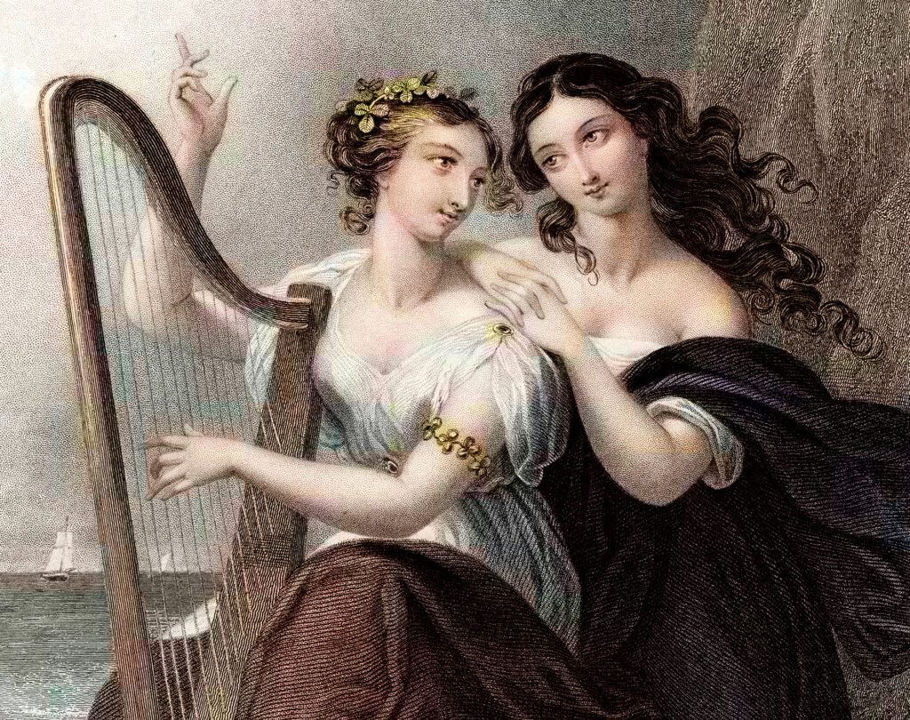 Two women from Irish mythology or folklore are depicted in this classic artwork, one playing a harp, symbolizing Irish music and heritage, while the other gently rests her hand on her shoulder. The harp, an iconic symbol of Ireland, connects to the country’s rich musical tradition and cultural history. This image is ideal for exploring what to read, watch, and listen to before visiting Ireland.