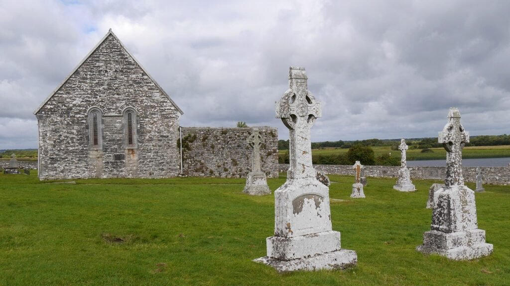 Historic ruins of Clonmacnoise Monastic Site along the River Shannon, a must-see stop on the scenic drive from Dublin to Galway, showcasing ancient Irish history and stunning landscapes.